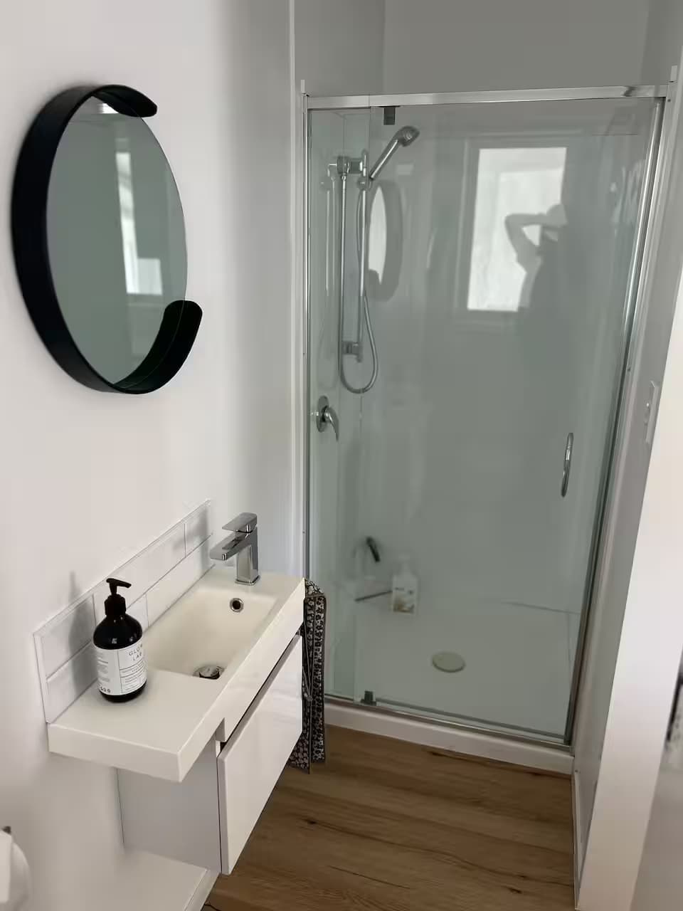 Modern bathroom vanity with round mirror